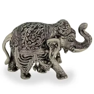 ilver plated elephant statue for living room Vastu elephant idol for wealth and prosperity Traditional elephant figurine for gifting Handmade metal elephant showpiece for office Feng Shui elephant décor for positive energy Housewarming gift decorative elephant Indian elephant statue for good luck Royal elephant showpiece for drawing room Intricately carved elephant for interior decoration Ethnic silver elephant for Diwali gift