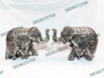 German silver elephant showpiece Elephant figurine for Vastu Handcrafted silver home decor Antique silver elephant statue Feng Shui good luck elephant Decorative metal elephant figurine Handmade spiritual gift items Silver elephant for office desk