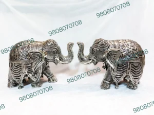 German silver elephant showpiece Elephant figurine for Vastu Handcrafted silver home decor Antique silver elephant statue Feng Shui good luck elephant Decorative metal elephant figurine Handmade spiritual gift items Silver elephant for office desk